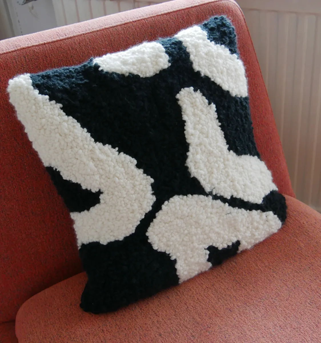 A cow inspired pillow using black & white